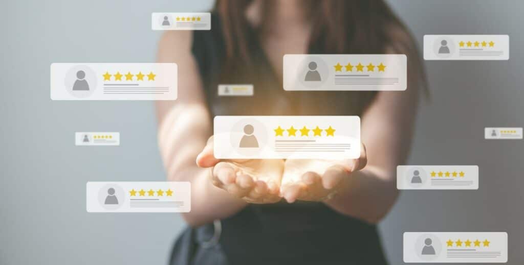 A woman holding out her hands with review icons surrounding her